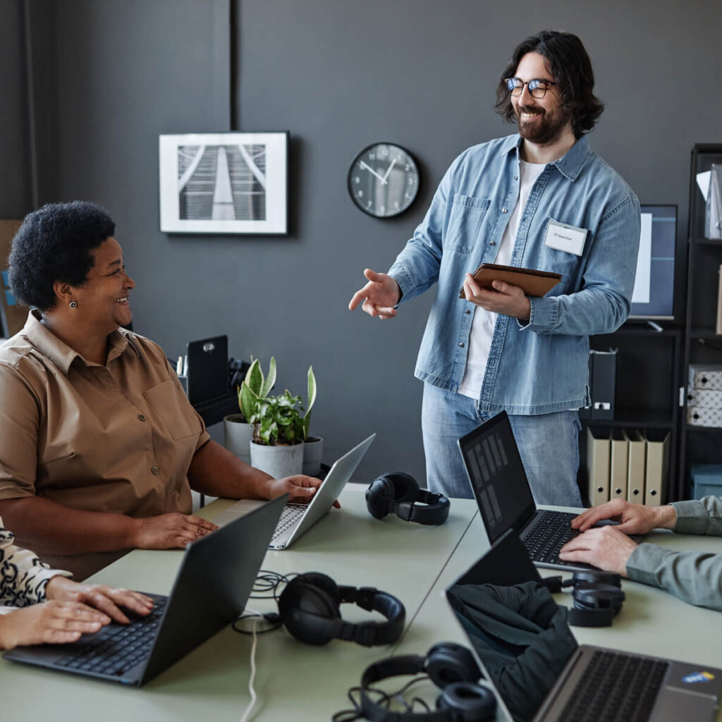 bearded young man leading computer class for senio 2023 11 27 05 30 10 utc 2 1.jpg